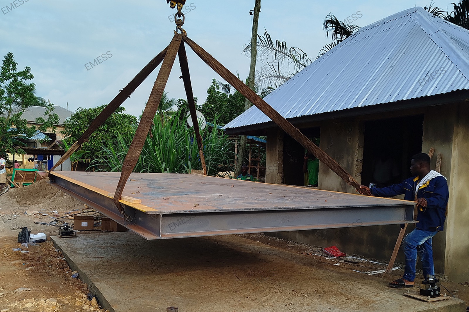 Crane lowering a weighbridge deck into place