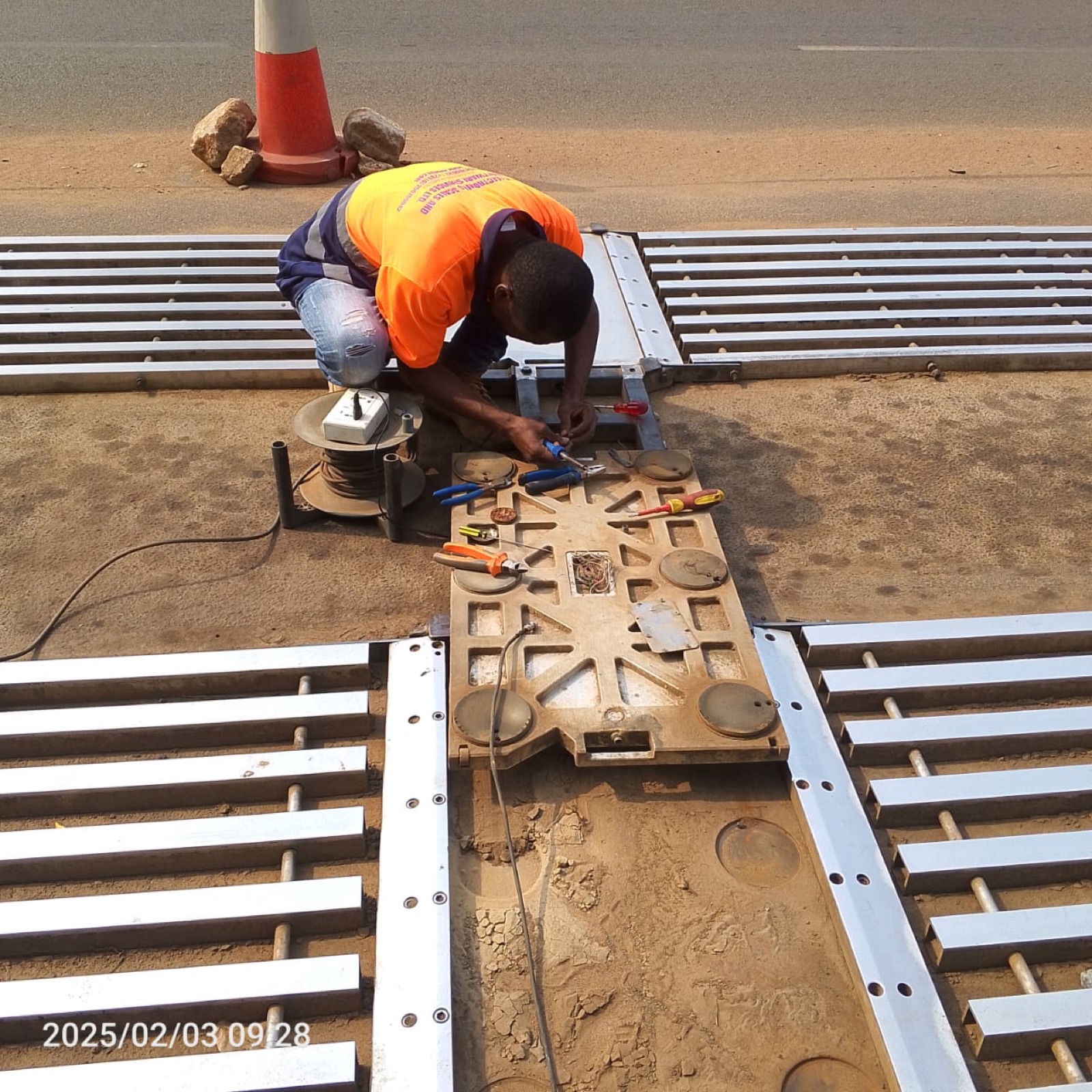 Technician servicing a portable scale junction box