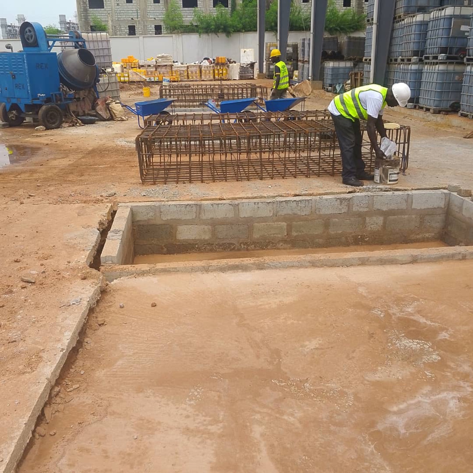 Worker finishing a weighbridge foundation pit