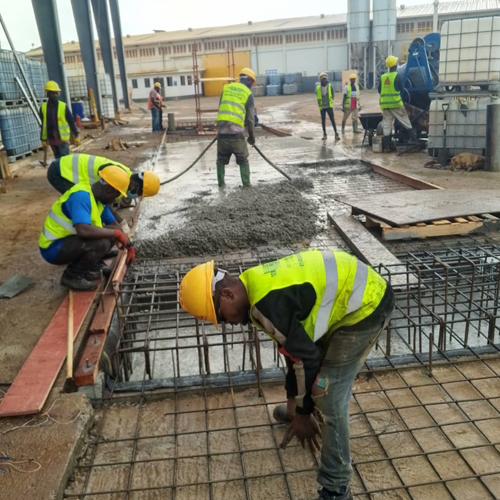 Team pouring concrete for a weighbridge foundation