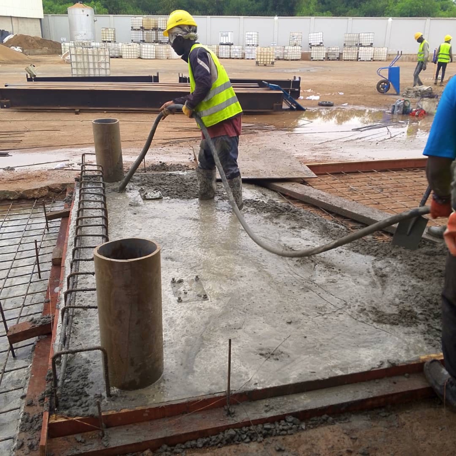 Worker pouring a weighbridge foundation